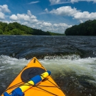 Surfing in a small rapid.